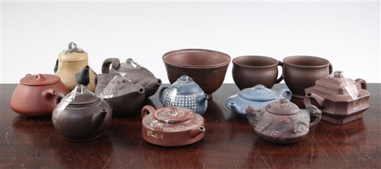 Ten Yixing pottery teapots and covers, two cups and a bowl, 20th century, 5.8cm